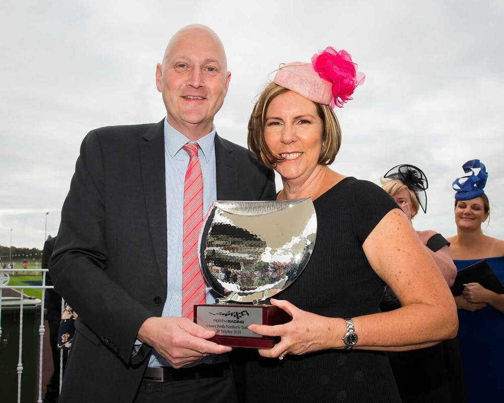 Danielle Pratt receives the trophy for Man Booker's victory at Ascot